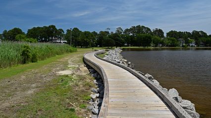 Wooden walkway along the water's edge.