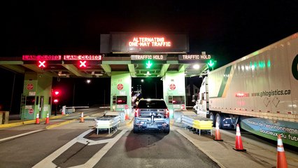 The toll booth at the Thousand Islands Bridge.  Once traffic cleared for us to proceed, each vehicle had to individually stop and speak with the toll collector, who verified method of payment (E-ZPass in our case) before raising the gate to allow us through to cross the bridge.