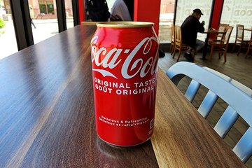A can of Coca-Cola with Canadian packaging, complete with a gold-colored top.