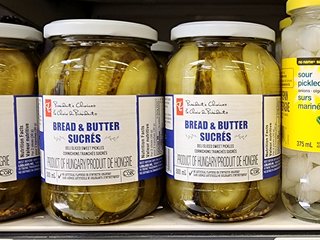 A jar of President's Choice bread and butter pickles.  President's Choice is another Loblaws brand.
