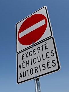 Signage prohibiting turns and entry into the busway, except for authorized vehicles.