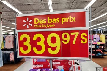Red and yellow price signage, which is typical for Canadian Walmart stores.  Note that the dollar sign appears after the price.  This is the normal convention in French-speaking Canada.