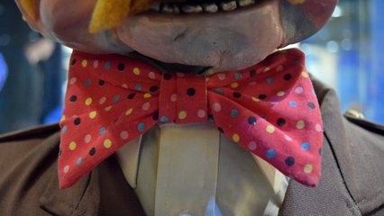 Sam's bow tie.  Prior to this, I had never realized that Sam's tie had so much color, being red with pink, yellow, blue, and black polka dots.