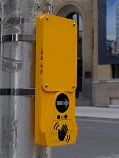 Pedestrian signal call button at the intersection of Metcalfe and Nepean Streets.