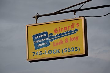 Sign for Girard's Lock & Key.