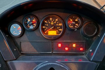 Dashboard of bus 4393, which looks like a typical New Flyer dashboard from the period.  That blank gauge all the way to the right is the place where a fuel gauge would go, but many agencies choose to skip the fuel gauge entirely.