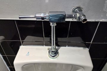 I also got photos of the urinals at the bowling alley, because of their strange looking flushometer.  I had never seen a urinal with such a square-looking flushometer before.  Definitely unique.