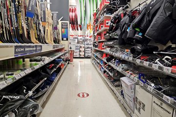 Sporting goods section at Canadian Tire, with an entire aisle just for hockey equipment.