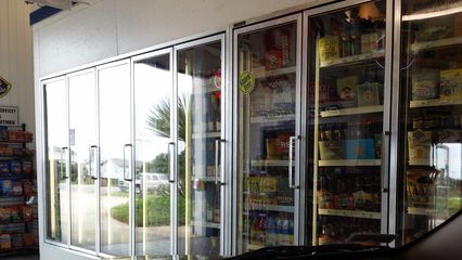 Coolers, mostly containing bottled beer, lined one wall of the store.