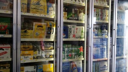 Coolers, mostly containing bottled beer, lined one wall of the store.