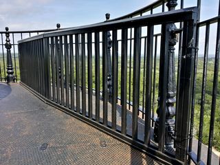 This additional railing, obviously not part of the original construction, serves a purpose that you might not think about: to prevent visitors from tossing items off of the balcony, as this area is directly over the entrance to the lighthouse, which receives a lot of foot traffic.
