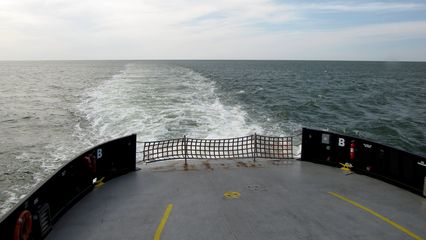 The empty stern, with the boat's wake beyond.