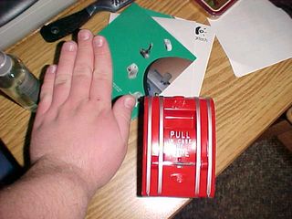 Compare this with the photograph below, taken in Potomac Hall with the more recent version of the classic Edwards pull station that I have in my fire alarm collection, being size-compared with the same hand.