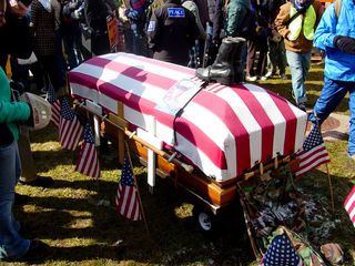 One group had a flag-draped coffin, topped by the boots and photo of what is presumably a fallen serviceman.