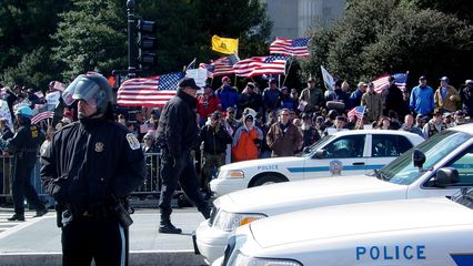 The counter-protesters were out in force, separated from the anti-war group by barriers and caution tape. Additionally, a row of Park Police officers enforced something of a no man's land between the two groups.