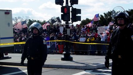 The counter-protesters were out in force, separated from the anti-war group by barriers and caution tape. Additionally, a row of Park Police officers enforced something of a no man's land between the two groups.