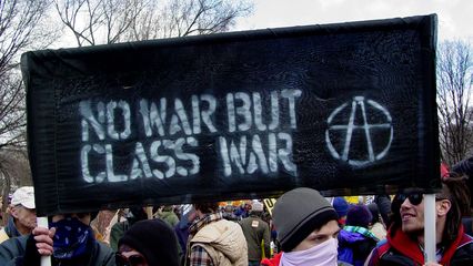 This "No war but class war" banner was one of the black bloc's larger banners.