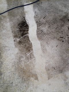 Narrow line of washed concrete down the middle, to show the difference.