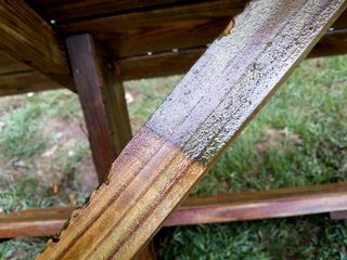 The difference between dirty and clean on a support beam for the tabletop.
