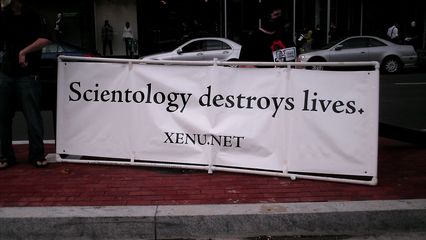 For this raid, we had two banners. One, at the head of the triangle, read, "BOOOO SCIENTOLOGY", while the other, in the Connecticut Avenue median, read, "Scientology destroys lives."