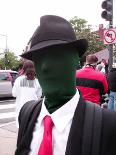 This man came as the embodiment of Anonymous. When the Anonymous insignia is shown with a visible body, the body is generally green with no features.