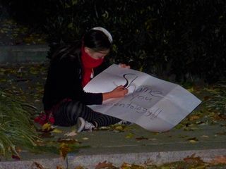 JB takes a moment to work on a sign.