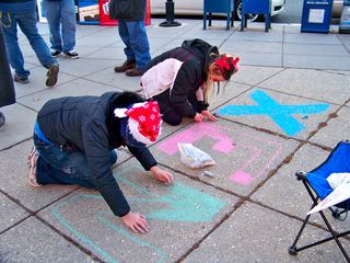 MaidofWin and JB chalk the sidewalk. This message would ultimately spell out XENU.NET.