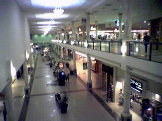 On the same day, I also went to Tanglewood Mall just outside Roanoke.  This was my first time going to Tanglewood after seeing it on deadmalls.com.  Learning the history of the mall caused me to notice some vintage features left in place after two interior renovations.  Below left shows what is believed to be an original ceiling from the 1970s at the "dead" end of the mall where there is an empty anchor store.  Below right shows what is believed to be a swath of original flooring from the 1970s next to a jewelry store near the center of the mall.  The flooring is dark wood parquet, and also brick.