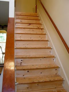The stairs, meanwhile, were obviously not intended for hardwood. The number of knots in the wood says it all. The wood on the stairs was completely replaced with smoother wood with no knots.
