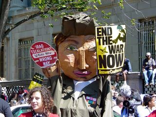 A street puppet, dressed in a military uniform, called for an end to the war.