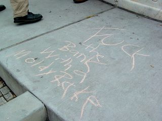 Someone wrote a slightly uncouth message about the World Bank in chalk next to the fountain.