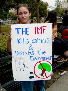 As this was a march against the World Bank and IMF that was feeding into the larger anti-war march downtown, many participants' signs reflected both topics on the two sides of their posters.