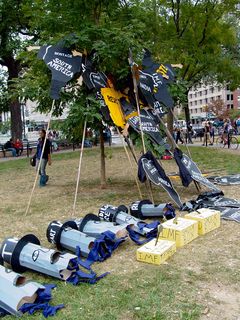 The Mobilization for Global Justice brought their own props with them as well. You may recall the large heads from A16, while the signs, representing various regions weighted down by debt, are new, combining a cutout of the region in question with the famous photo of the prisoner at Abu Ghraib.