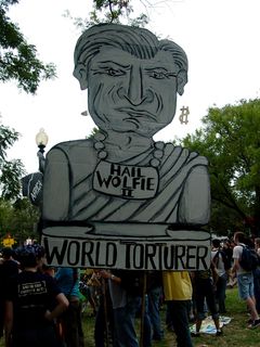 One of the largest signs depicted Paul Wolfowitz, president of the World Bank, as an emperor, and world torturer.