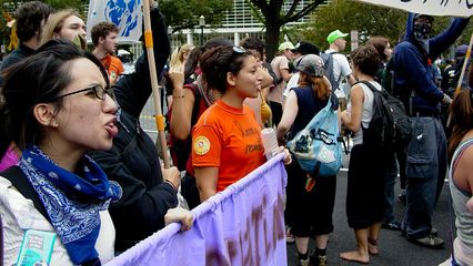 Demonstrating in front of the World Bank, at the corner of 19th Street and Pennsylvania Avenue NW.