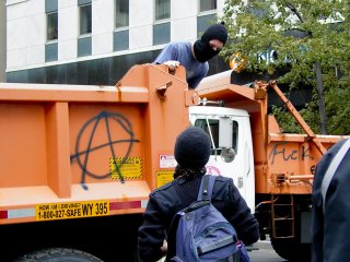 Two dump trucks were spray painted with anarchist symbols at 17th and H Streets NW.