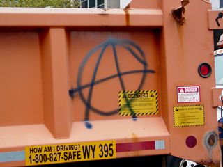 Two dump trucks were spray painted with anarchist symbols at 17th and H Streets NW.