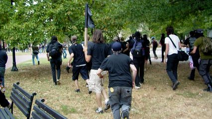 After the brief brush with Park Police, the black bloc heads north and exits Lafayette Square.
