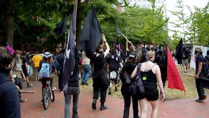 After the brief brush with Park Police, the black bloc heads north and exits Lafayette Square.