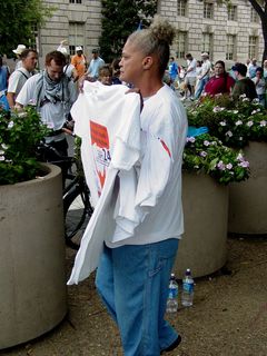 This woman was standing at the same street corner as we were, selling commemorative September 24 t-shirts. When she commented that she only had two left, I jokingly commented to the person I was with, "If we buy them, do you think she'll go away?"