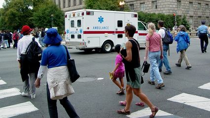 The march parted momentarily to allow an ambulance to continue north on 14th Street NW.