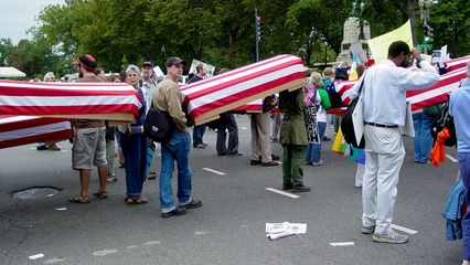 Since the October 2, 2004 march (Day of Activism photography set), cardboard coffins, either black-draped or flag-draped, have been a staple at anti-war demonstrations.