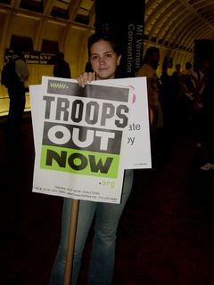 At Mt. Vernon Square station, this woman was holding two signs while waiting for the train. One about getting the troops out of Iraq, and another reminding us all about the 2006 midterm elections.