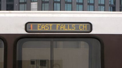 Simulated Silver Line train, showing Orange Line to East Falls Church on the destination sign, on the inbound track (since our train was on the outbound track). While the simulated Silver Line service was underway in the week prior to this, the simulated Silver Line trains were signed as Orange Line trains to Largo and East Falls Church, and carried passengers between those locations. West of East Falls Church, the trains ran without passengers.