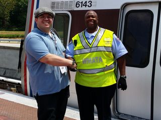Handshake with Detrick Washington, the operator of the first Silver Line train.
