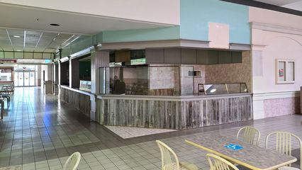 Former Angelo's Pizza (later Laconi's Pizzeria) space in the food court.  This was the only restaurant in the food court to have its own seating area, separate from the seating in the mall itself.