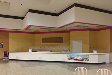 The same space as it appeared on August 30, 2014.  This was after Flavor Cravers had closed, and before Sooner BBQ redecorated the space.