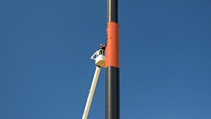 As a testament to how new this location was, there was a guy on a lift giving the pole of that massive sign its first coat of black paint on top of the primer.