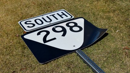 A reassurance shield for State Route 298, i.e. Genesis Road, was on the ground.  I assume that someone hit it at some point, and it had not yet been put back up.