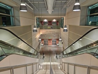Escalators and stairs at the KAT hub between street level and the upper level.
